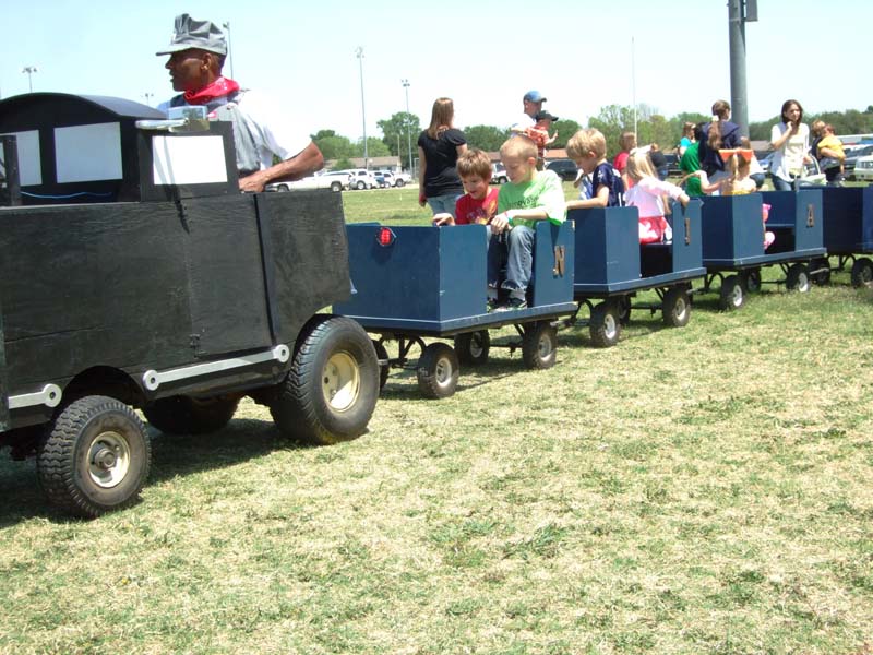 photo of kids riding a train